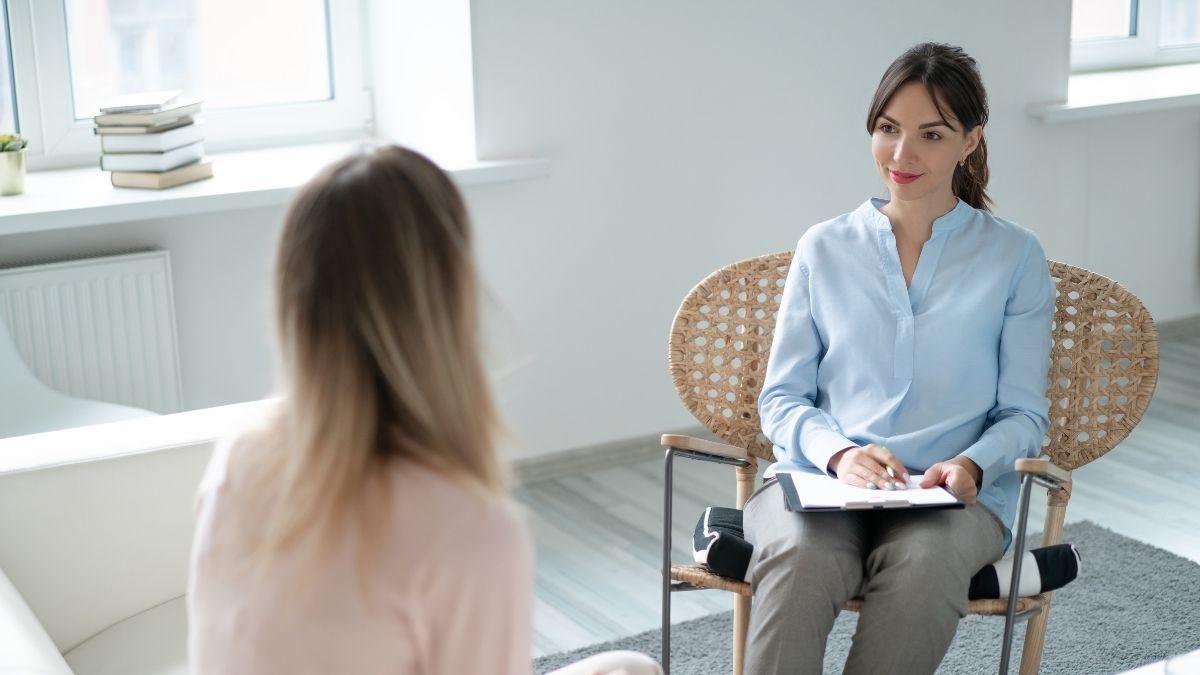 Therapist and client in a session discussing DBT vs CBT therapy options