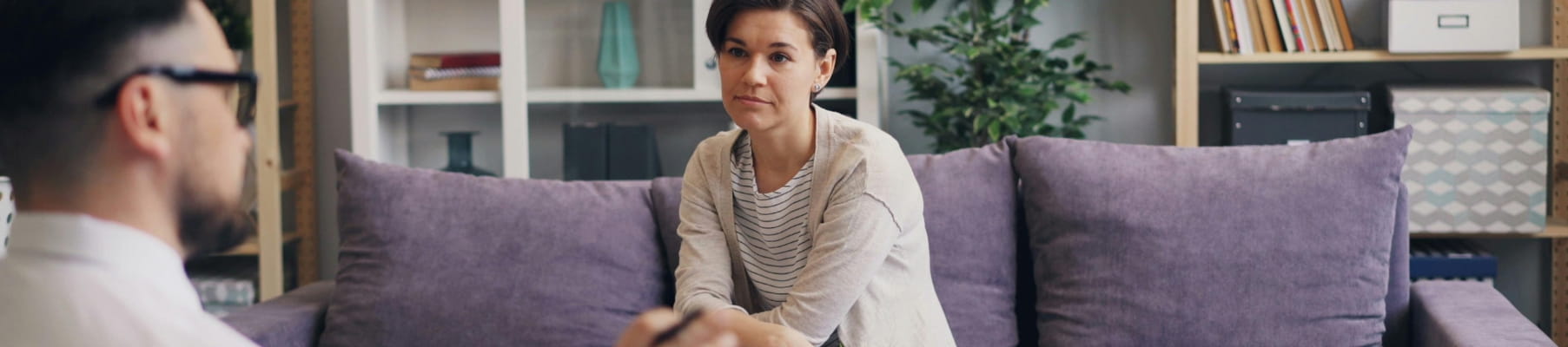 Therapist taking notes while a client talks during a session at 101 Psychotherapy in Vaughan