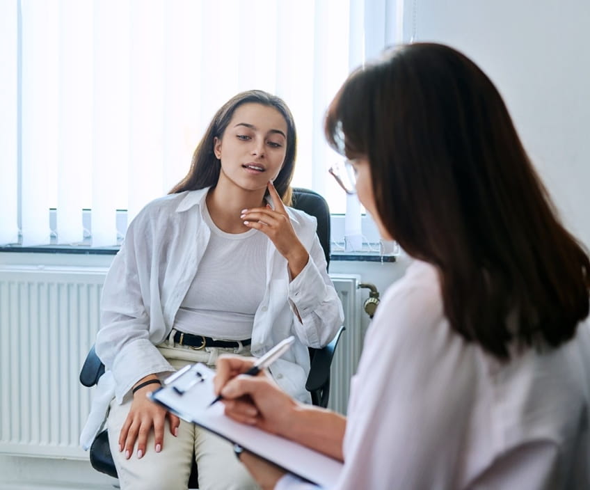 Student speaking with a therapist during a first counselling appointment