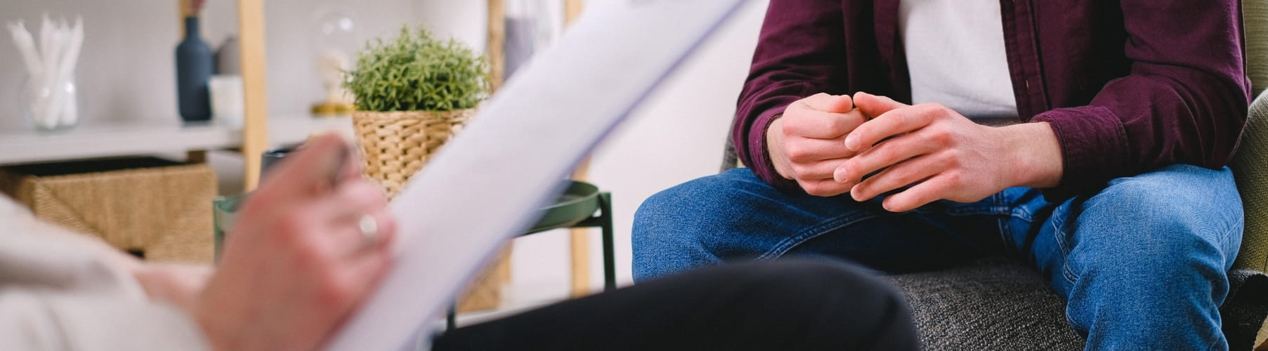 Client with clasped hands at a substance abuse counselling session in Vaughan