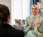 Therapist and client talking on a sofa
