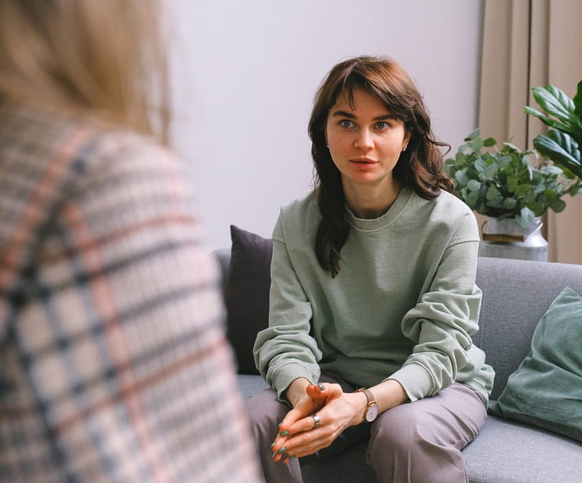 Woman speaking with a therapist during a free consultation