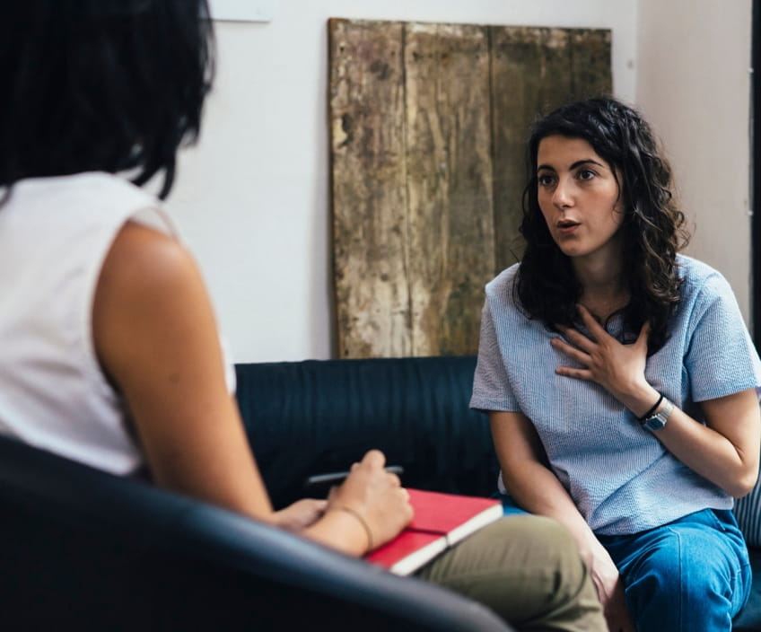 Client talking to a therapist taking note
