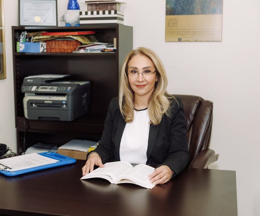 Therapist at her desk in a Vaughan therapy office, available for student consultations