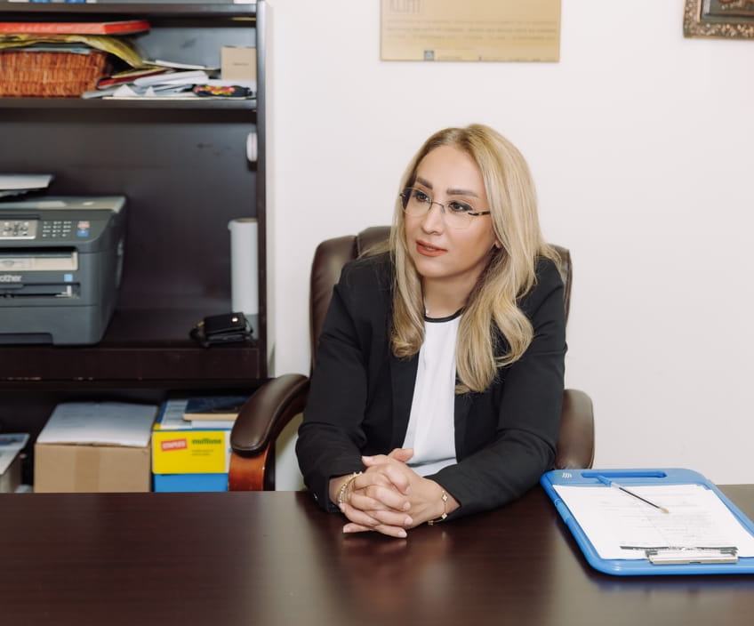 Burnout therapist at her desk in a Vaughan clinic, ready for a first session