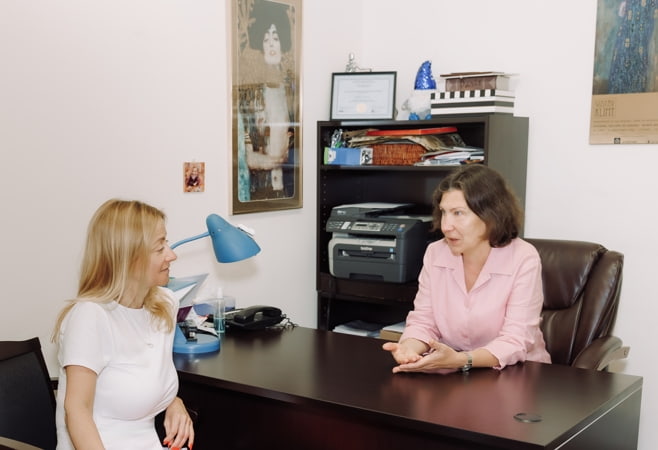 Client and therapist talking through a step by step plan