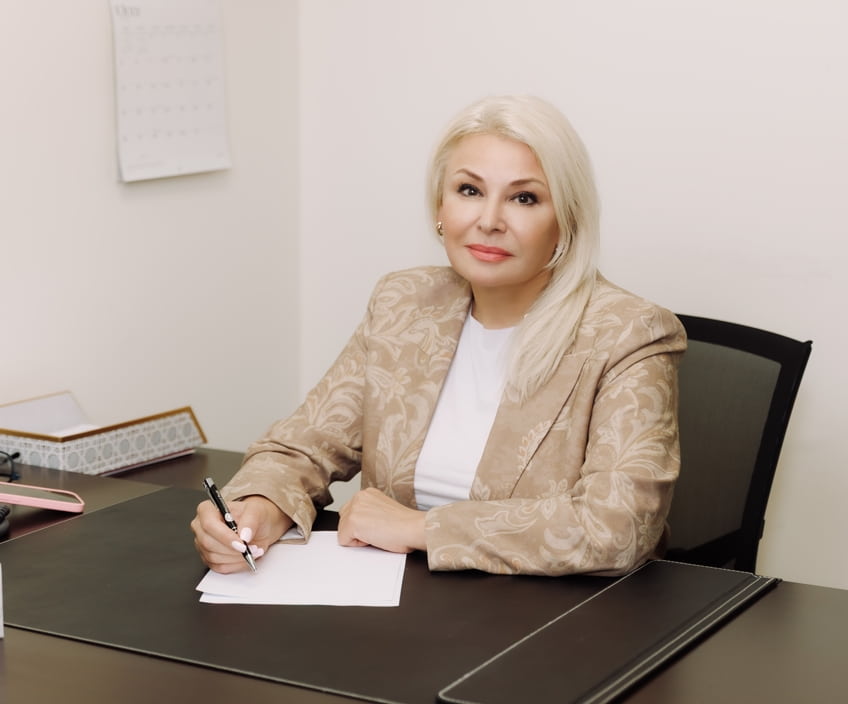 A therapist making notes at her desk in the Vaughan clinic office