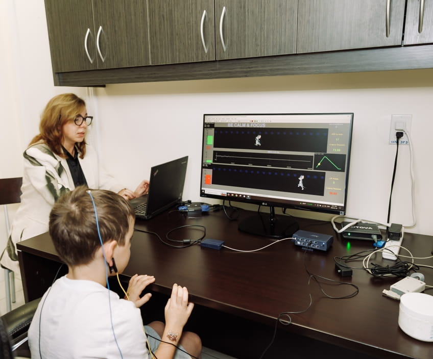 Child in a neurofeedback session for ADHD attention training